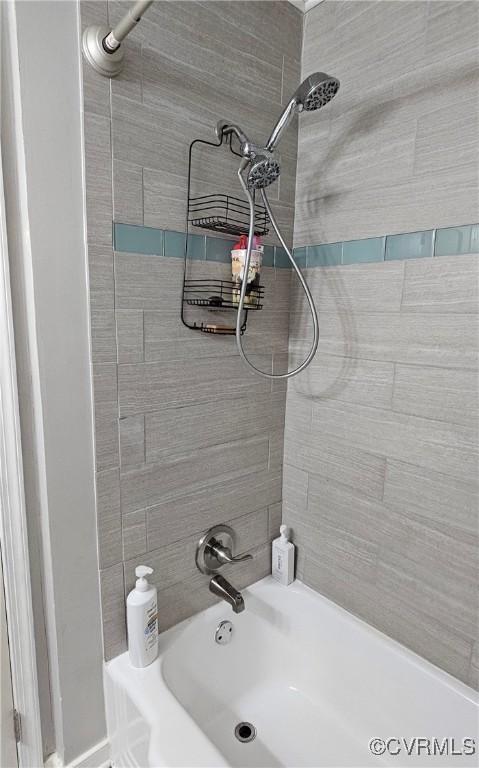 full bath featuring washtub / shower combination