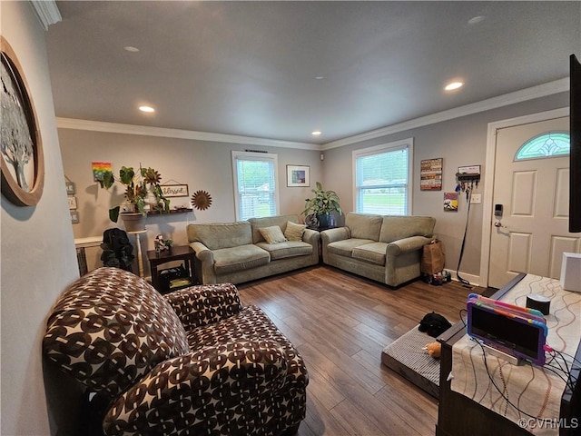 living area with hardwood / wood-style floors, recessed lighting, and crown molding