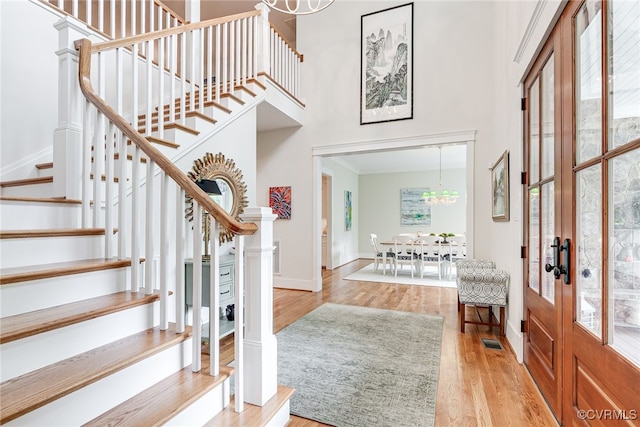 8 Nomas Ln, Henrico, VA 23238 - foyer featuring wood finished floors, french doors, stairs, a chandelier, and baseboards