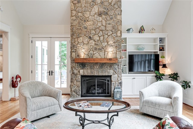 8 Nomas Ln, Henrico, VA 23238 - living room with lofted ceiling, wood finished floors, french doors, and a fireplace