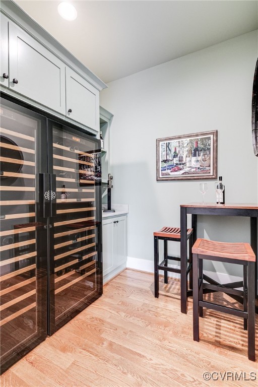 8 Nomas Ln, Henrico, VA 23238 - office area with light wood-style floors, baseboards, and a bar