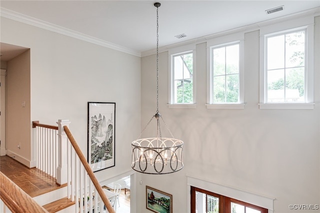 8 Nomas Ln, Henrico, VA 23238 - detailed view of a chandelier, crown molding, and baseboards