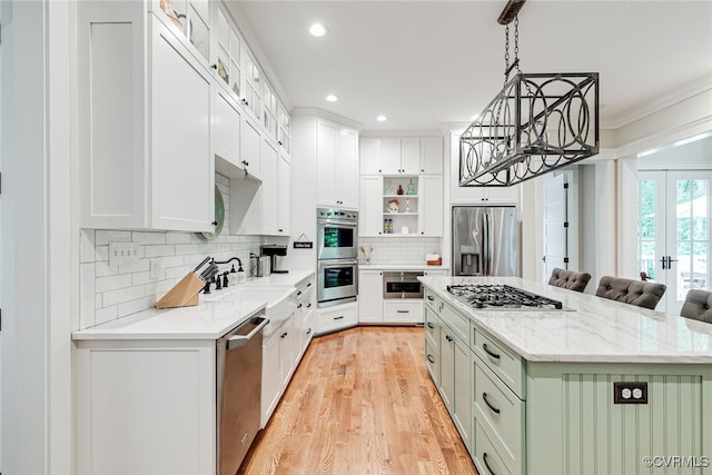 8 Nomas Ln, Henrico, VA 23238 - kitchen featuring appliances with stainless steel finishes, a sink, a center island, backsplash, and light wood finished floors