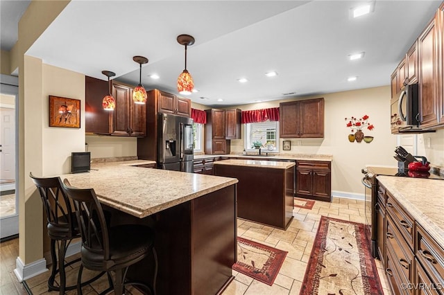 5541 Cedar Ln, Amelia Courthouse, VA 23002 - kitchen featuring stainless steel appliances, light countertops, a sink, and recessed lighting