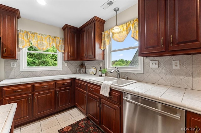 5541 Cedar Ln, Amelia Courthouse, VA 23002 - kitchen featuring dishwasher, a sink, plenty of natural light, and light tile patterned floors