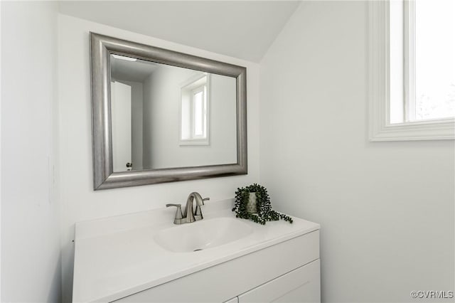 bathroom with healthy amount of natural light and vanity