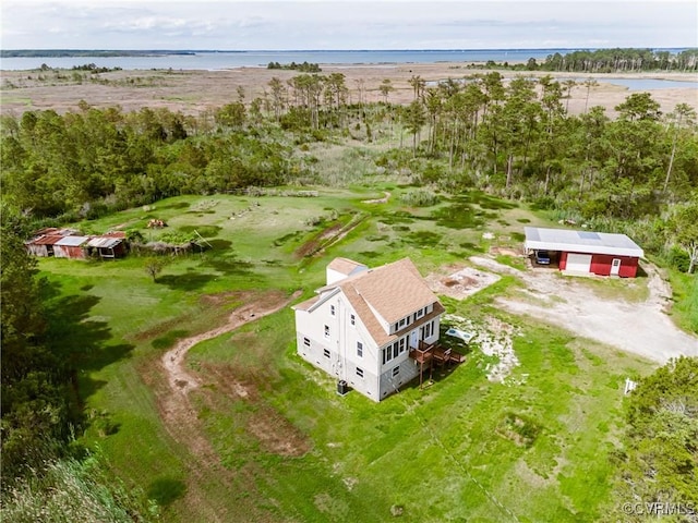 aerial view of property and surrounding area featuring a large body of water