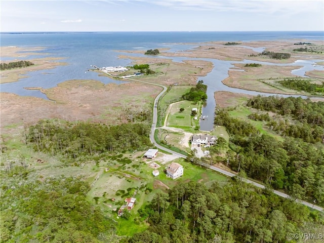 aerial view of property and surrounding area with a nearby body of water