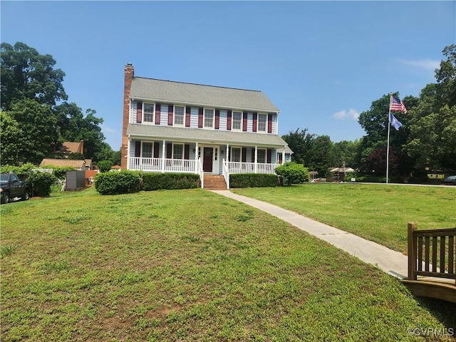 8900 Emory Oak Ln, Ampthill, VA 23237 - colonial home with a porch, a front lawn, and a chimney