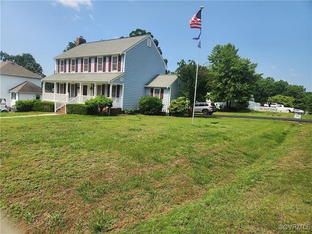 8900 Emory Oak Ln, Ampthill, VA 23237 - colonial home featuring a chimney, covered porch, and a front yard