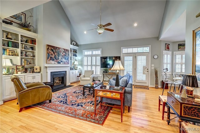 645 Farnham Cir, North Chesterfield, VA 23236 - living room with a ceiling fan, a fireplace with flush hearth, high vaulted ceiling, light wood finished floors, and healthy amount of natural light