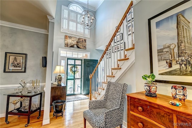 645 Farnham Cir, North Chesterfield, VA 23236 - entrance foyer featuring wood finished floors, ornamental molding, stairs, a chandelier, and a towering ceiling