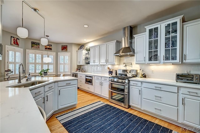 645 Farnham Cir, North Chesterfield, VA 23236 - kitchen with stainless steel appliances, wall chimney exhaust hood, a sink, light countertops, and recessed lighting