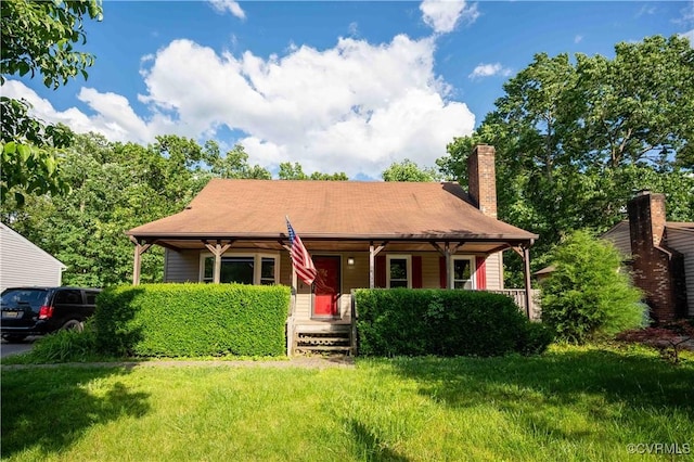 9323 Edington Dr, North Chesterfield, VA 23237 - view of front of home featuring covered porch, a chimney, and a front yard