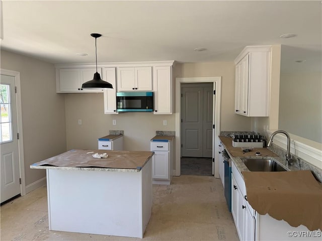 17420 Wedgewood Dr, Lanexa, VA 23089 - kitchen featuring a sink, dishwasher, hanging light fixtures, a kitchen island, and white cabinetry