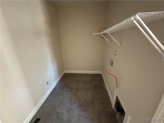 17410 Wedgewood Dr, Lanexa, VA 23089 - clothes washing area featuring baseboards and dark tile patterned flooring