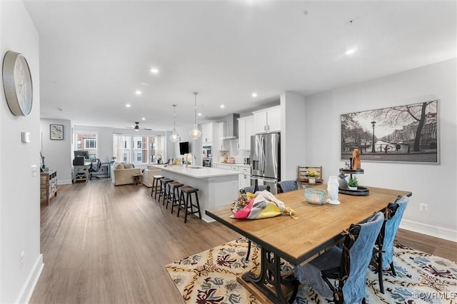 526 Greybull Walk Unit B, Henrico, VA 23233 - dining room with light wood finished floors, recessed lighting, baseboards, and ceiling fan