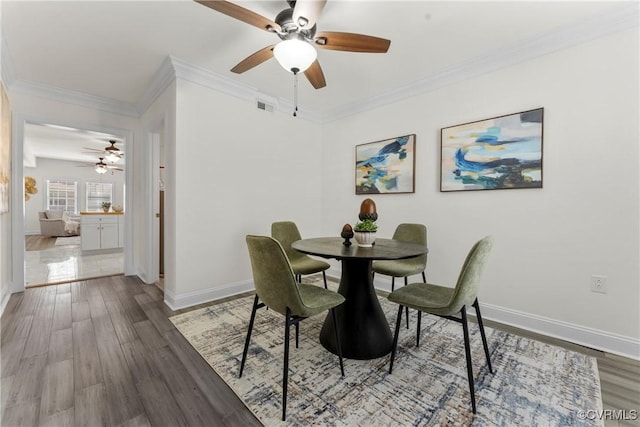 1216 N 30th St, Richmond, VA 23223 - dining area with ceiling fan, crown molding, and wood finished floors