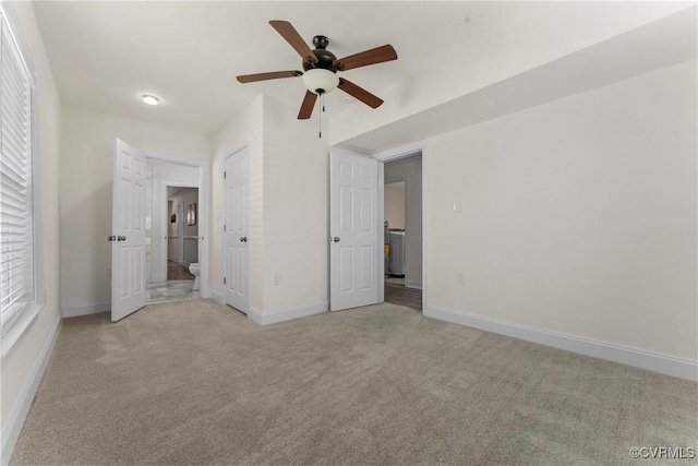 1216 N 30th St, Richmond, VA 23223 - unfurnished bedroom with light colored carpet and ceiling fan