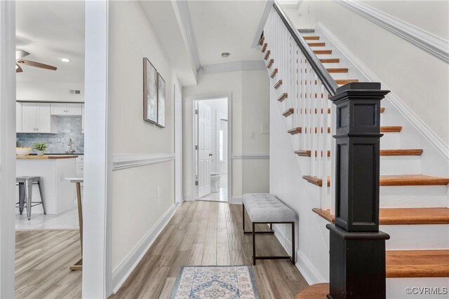 1216 N 30th St, Richmond, VA 23223 - staircase featuring ceiling fan, wood finished floors, recessed lighting, and ornamental molding