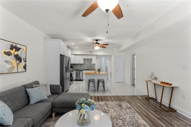 1216 N 30th St, Richmond, VA 23223 - living area featuring a ceiling fan, recessed lighting, and light wood finished floors