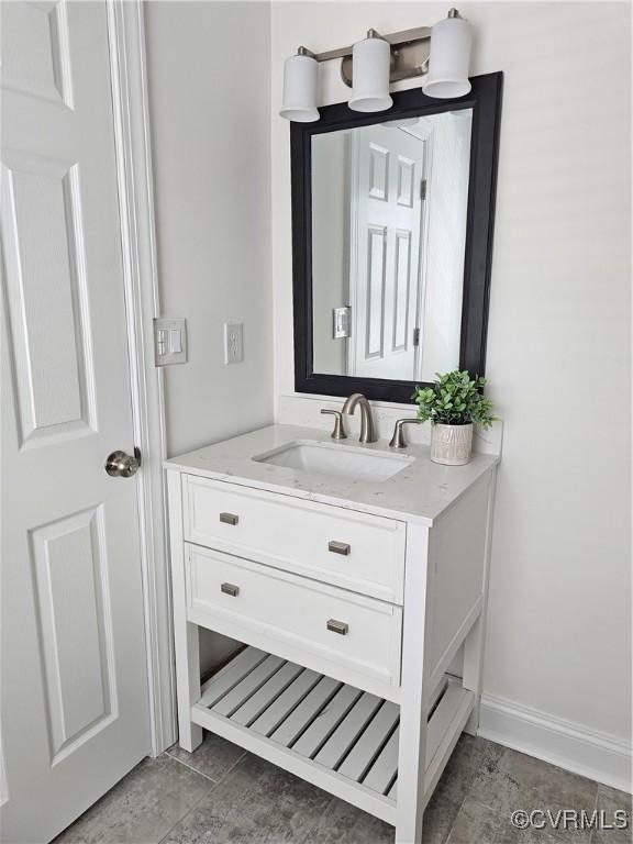 1216 N 30th St, Richmond, VA 23223 - bathroom with vanity and baseboards