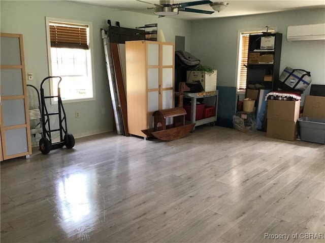 2577 Red Bank Rd, Ark, VA 23061 - garage with a wall mounted AC, ceiling fan, and baseboards