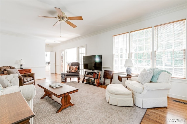 9905 Carrington Pl, Henrico, VA 23238 - living area featuring crown molding, healthy amount of natural light, wood finished floors, and ceiling fan