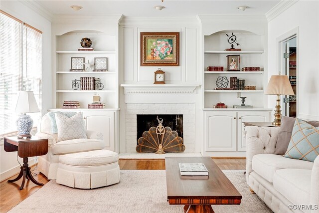 9905 Carrington Pl, Henrico, VA 23238 - living area featuring built in features, ornamental molding, wood finished floors, and a fireplace