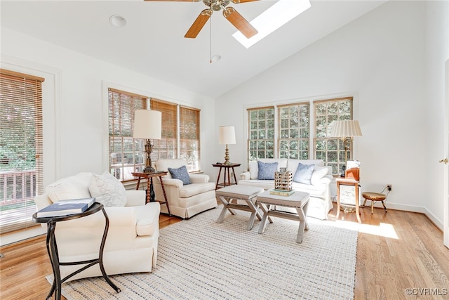 9905 Carrington Pl, Henrico, VA 23238 - living area with a ceiling fan, a skylight, high vaulted ceiling, light wood-type flooring, and baseboards