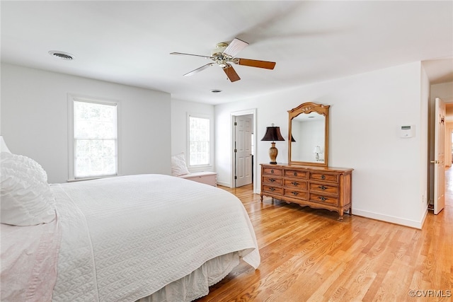 9905 Carrington Pl, Henrico, VA 23238 - bedroom with multiple windows, light wood finished floors, baseboards, and a ceiling fan