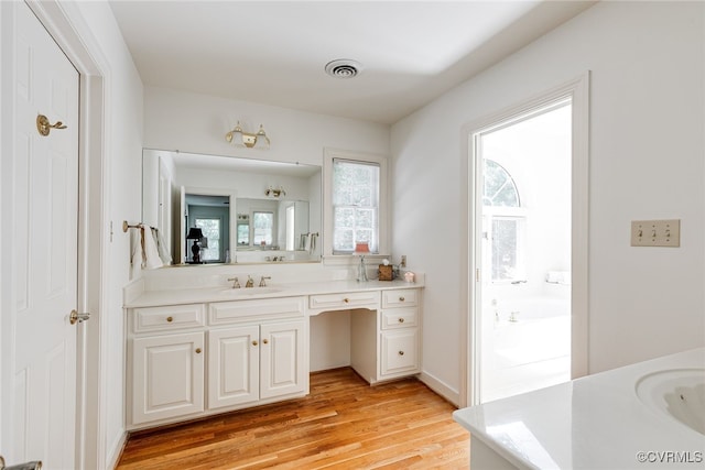 9905 Carrington Pl, Henrico, VA 23238 - bathroom with vanity, wood finished floors, and a tub to relax in