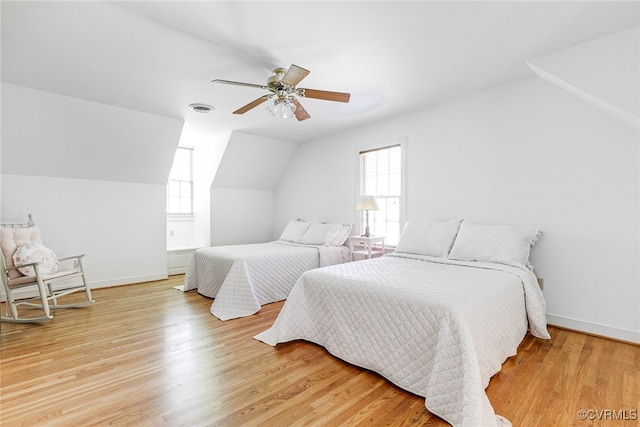 9905 Carrington Pl, Henrico, VA 23238 - bedroom featuring multiple windows, lofted ceiling, light wood finished floors, a ceiling fan, and baseboards