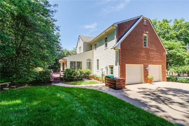 9905 Carrington Pl, Henrico, VA 23238 - rear view of property featuring a garage, asphalt driveway, a lawn, a wooden deck, and brick siding