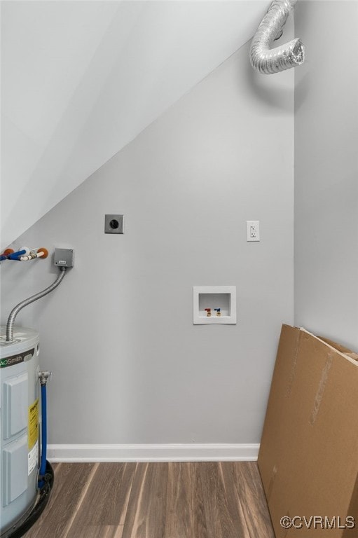 clothes washing area with hookup for an electric dryer, water heater, wood finished floors, baseboards, and hookup for a washing machine