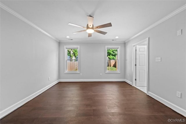 spare room featuring ornamental molding, a ceiling fan, dark wood finished floors, baseboards, and recessed lighting
