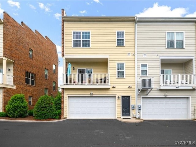 5435 Libbie Mill W Blvd, Henrico, VA 23230 - back of property featuring a garage and asphalt driveway