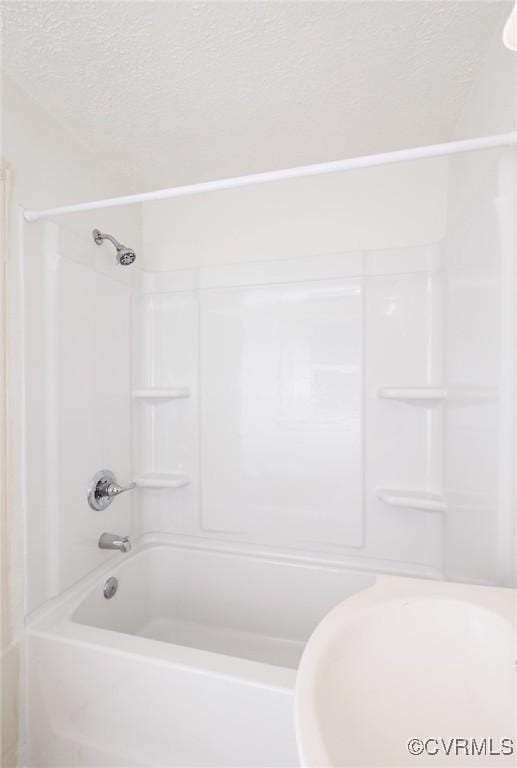 908 Rosemont Rd, Richmond, VA 23224 - bathroom with a textured ceiling and tub / shower combination