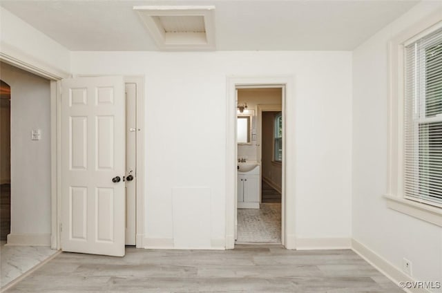 908 Rosemont Rd, Richmond, VA 23224 - unfurnished bedroom with light wood-style floors and connected bathroom