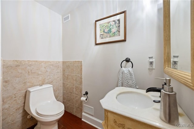 816 Riverside Park, Richmond, VA 23220 - bathroom with tile walls, toilet, wood finished floors, and vanity