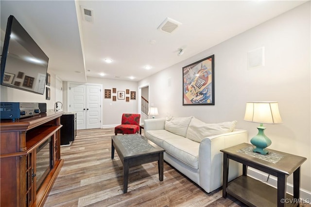 816 Riverside Park, Richmond, VA 23220 - living room featuring light wood-type flooring, baseboards, recessed lighting, and stairway