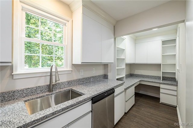 kitchen featuring dishwasher, a sink, white cabinets, and light stone countertops