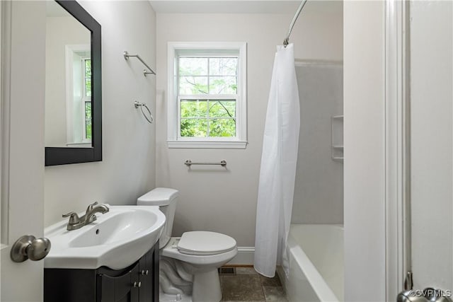 full bath with toilet, vanity, baseboards, and shower / tub combo with curtain