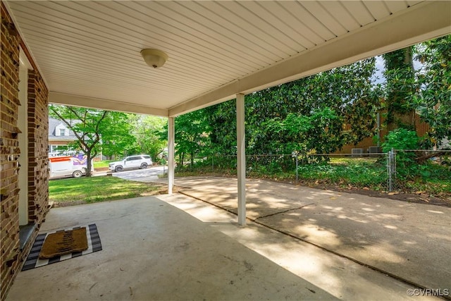view of patio featuring fence