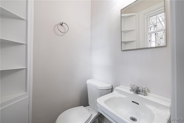 bathroom with a sink and toilet