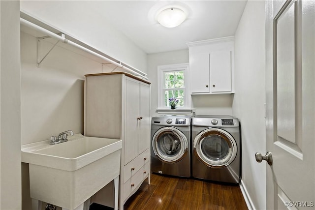 10910 Lesser Scaup Lndg, Chesterfield, VA 23838 - laundry room featuring independent washer and dryer, dark wood finished floors, and cabinet space