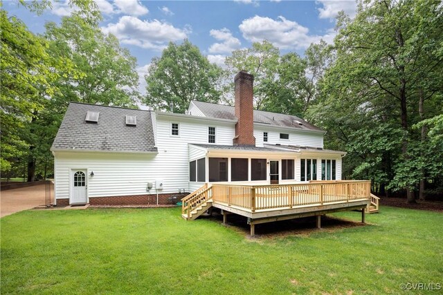 10910 Lesser Scaup Lndg, Chesterfield, VA 23838 - rear view of property with a sunroom, a chimney, a shingled roof, a lawn, and a deck