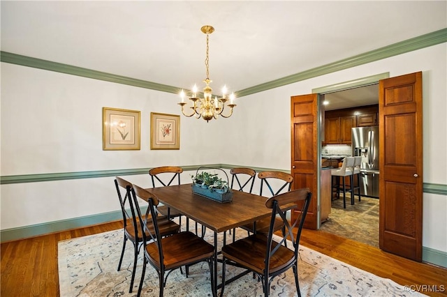 10910 Lesser Scaup Lndg, Chesterfield, VA 23838 - dining space featuring a chandelier, ornamental molding, wood finished floors, and baseboards