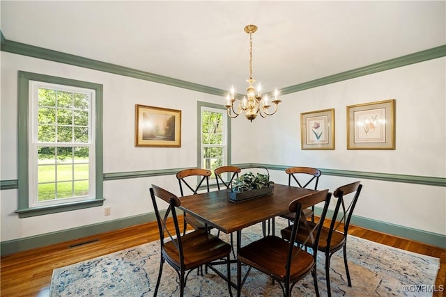 10910 Lesser Scaup Lndg, Chesterfield, VA 23838 - dining room with healthy amount of natural light, baseboards, a chandelier, and crown molding