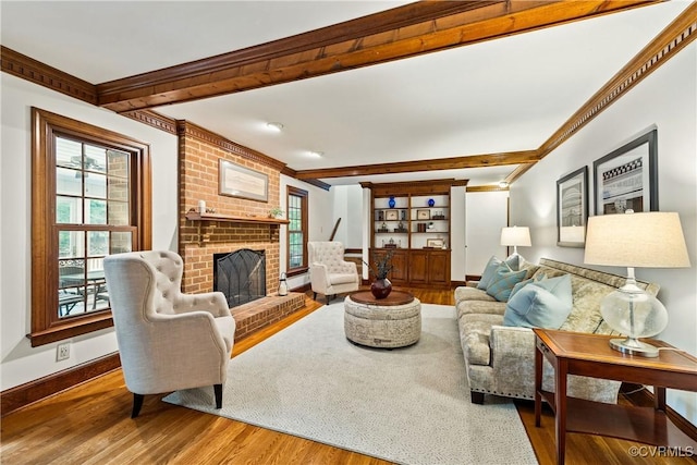 10910 Lesser Scaup Lndg, Chesterfield, VA 23838 - living area with wood finished floors, beamed ceiling, crown molding, a fireplace, and baseboards